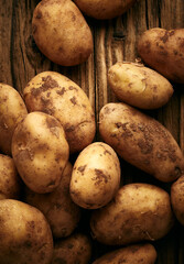 Potatoes on wooden planks food still life background