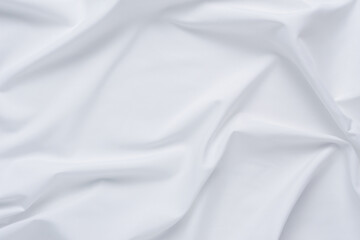 White fabric. luxurious white fabric texture background. Creases of satin, silk and cotton.