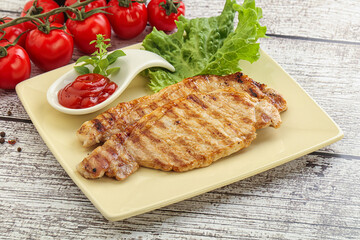 Grilled pork steak with ketchup