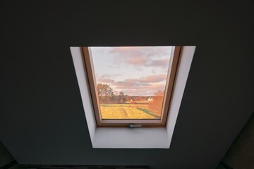 Lifestyle photo of a wooden roof window.