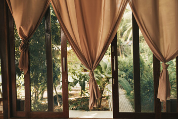 A glass doors with curtains
