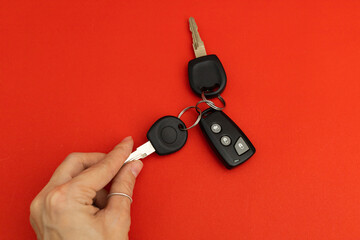 Car keys on red background