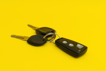 Car keys on yellow background