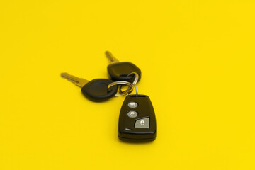 Car keys on yellow background