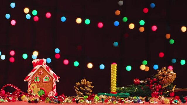 A man's hand lights fireworks on a table with Christmas toys. Congratulation, postcard. Background, insert captions, inscription, congratulations. Video, footage, intro, copy space. UHD 4K.