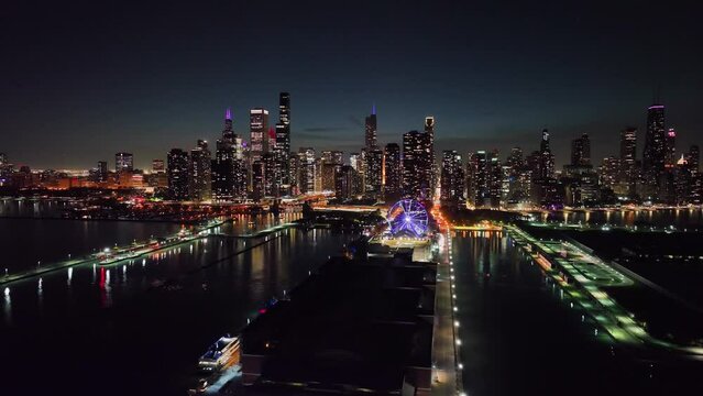 Aerial view of the Navy Pier and illuminated skyscrapers of Chicago, night in USA