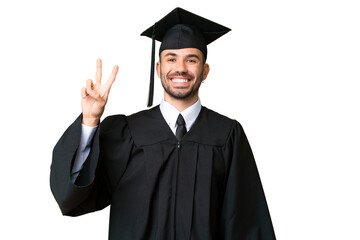 Young university graduate man over isolated chroma key background smiling and showing victory sign