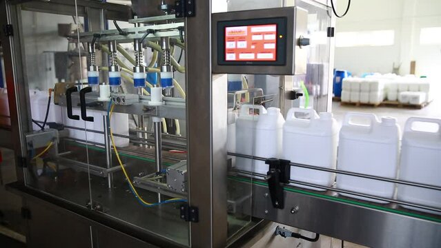 detailed images from the fragrance factory, bottle filling machines.