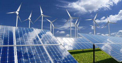 Solar panels and wind generators under blue sky