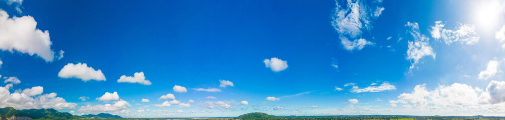 Beautiful view of blue sky with clouds. Beautiful shapes, partly cloudy. Colorful sunset. Natural sky background texture, beautiful color. Bright landscape in the blue sky.