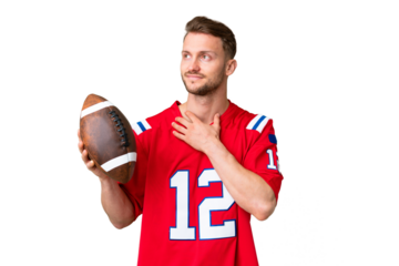 Young caucasian man playing rugby over isolated chroma key background looking up while smiling