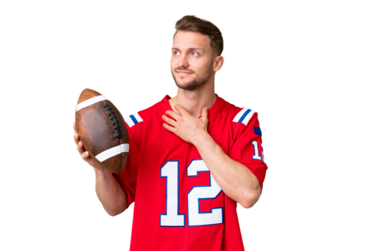 Young caucasian man playing rugby over isolated chroma key background looking up while smiling