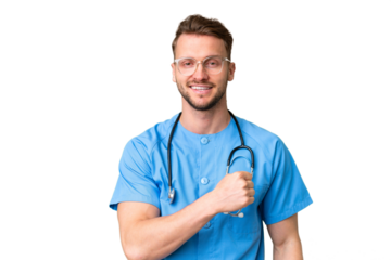 Young nurse man over isolated chroma key background celebrating a victory