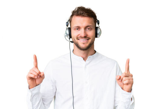 Telemarketer caucasian man working with a headset over isolated chroma key background pointing up a great idea