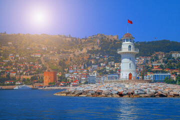 Fototapeta na wymiar Landscape of lighthouse in the port of Alanya. Copy space for text.