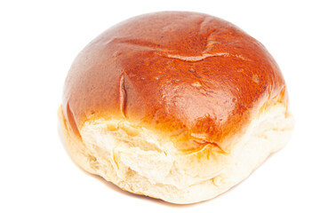 fresh baked wheat bun isolated on white.