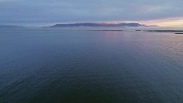 Beautiful Atlantic Ocean Calm Water Surface During Beautiful Cloudy Golden Hour Sunset. 4K Aerial Drone Footage.