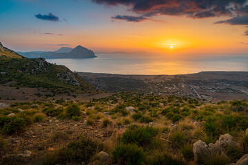 Sunset overlooking the Mediterranean coast. View from the top of Monte Monaco. Colorful sky. golden hour. Sicily. Italy
