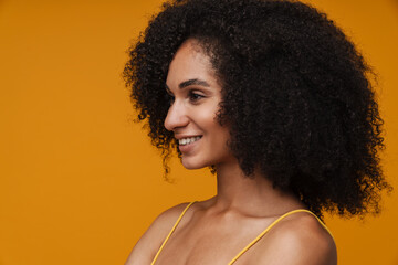 Profile portrait of young beautiful smiling happy curly woman