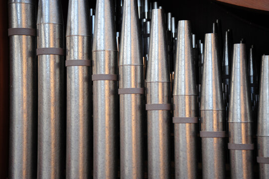 Church Pipes Attached To An Organ Indoors.