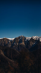 Snowy mountains against a blue sky