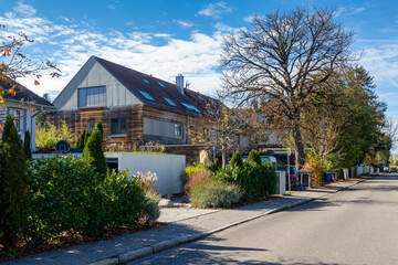 Germany, Bavaria, Munich, Street in front of modern passive house with wooden walls
