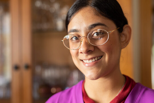 Happy Healthcare Worker Wearing Eyeglasses At Home