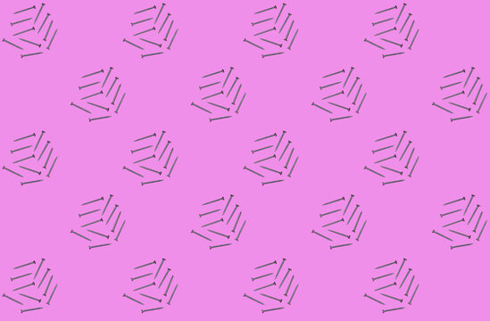 Pattern of rows of screws flat laid against pink background