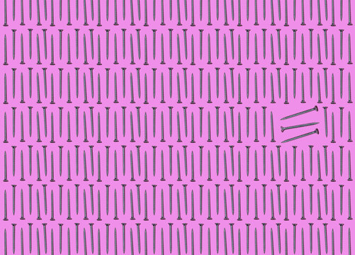 Pattern of rows of screws with few standing out