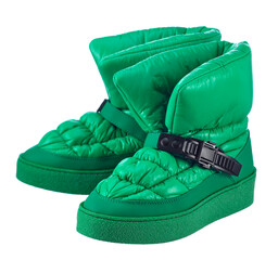 Elegant pair of women's shoes made of green fabric with a black plastic clasp, on a green polyurethane sole, isolated on a white background.  - 551483586