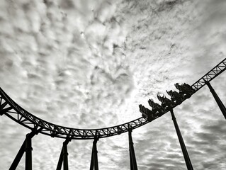 Low angle view of rollercoaster in background of sky in black and white - Powered by Adobe