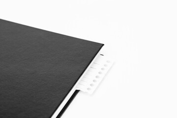 a washed-out spring notebook covered in a black notebook