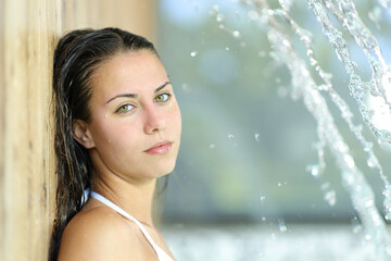 Beauty teen in spa looks at camera