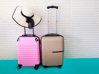 Travel concept with pink luggage in the airport terminal waiting area, summer vacation concept