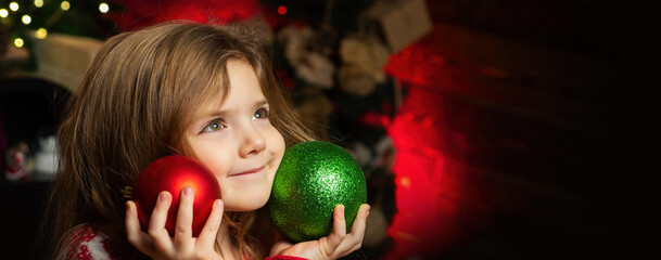 Winter holidays. Happy childhood. Child dreamy girl on christmas eve. Wish to meet santa.