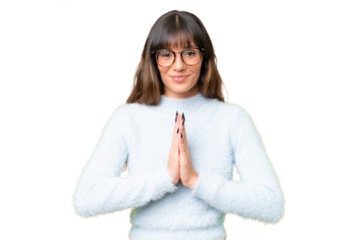 Young caucasian woman over isolated chroma key background keeps palm together. Person asks for something
