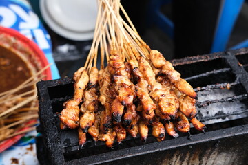 Sate Ayam (Chicken satay) with peanut sauce. One of the popular street food in Indonesia.
