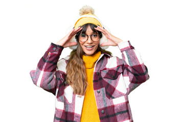 Young caucasian woman wearing winter muffs over isolated chroma key background with surprise expression