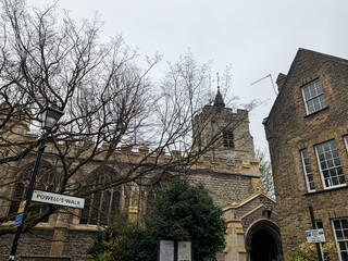 Church street view in Chiswick, West London, England. St. Nicholas church. St Nicholas Church, Chiswick. The west tower dates from the 15th century and the remainder was rebuilt in 1884, located in we