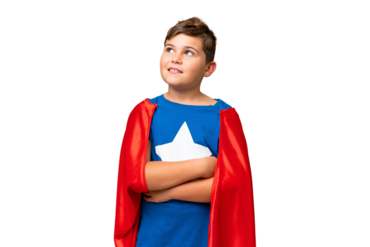 Super Hero caucasian kid over isolated chroma key background looking up while smiling