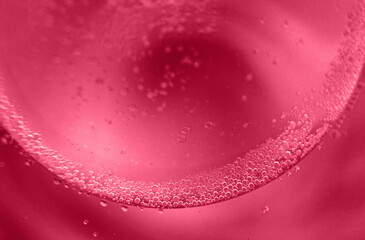 abstract light viva magenta background with oil circles . bubbles of water close up