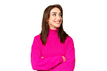 Young caucasian woman over isolated chroma key background looking up while smiling