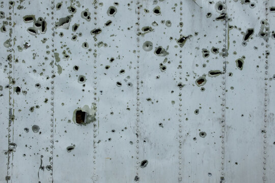 Traces of shelling. Holes from shell fragments. War in Ukraine.