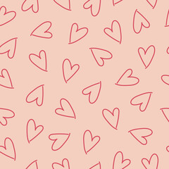 Abstract seamless pattern with red hearts on pink background. Hand drawn doodle style