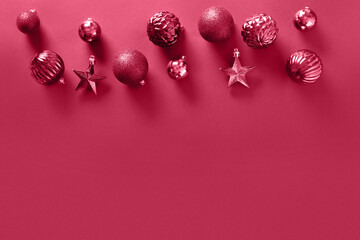 Christmas viva magenta baubles on monochrome background. View from above. Copy space. Xmas festive...
