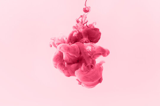 Color magenta paint in water. Abstact photo