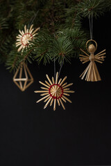 Christmas decorations are made of straw. Christmas decor. Small depth of field