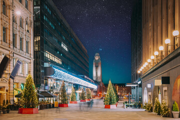 Helsinki, Finland. Night Starry Sky Above Shopping Mall And Helsinki Central Railway Station. Night View Of Keskuskatu Street In Evening Christmas New Year Xmas Festive Illumination. Bright Stars.