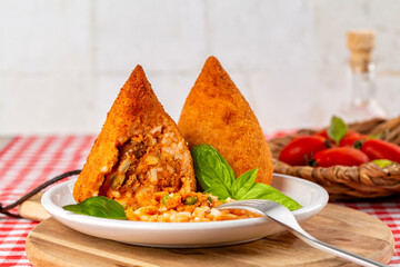 Sicilian rice balls. Conical shaped arancini, stuffed, coated with breadcrumbs and deep fried. ...