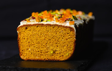 Carrot cake on black background